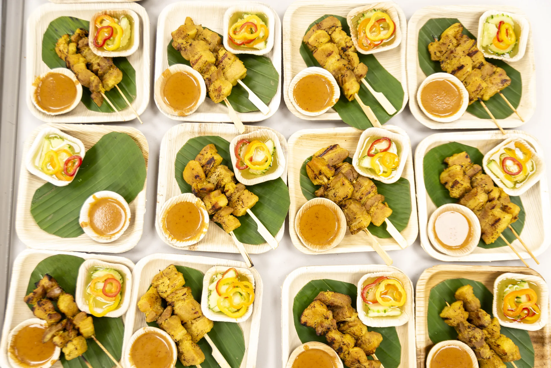 An overhead view of carefully arranged plates of colorful food.